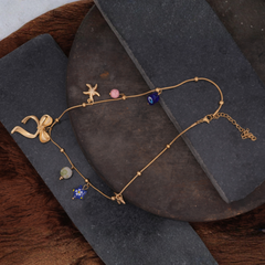 Gold-Tone Charm Necklace with Bow and Enamel Accents
