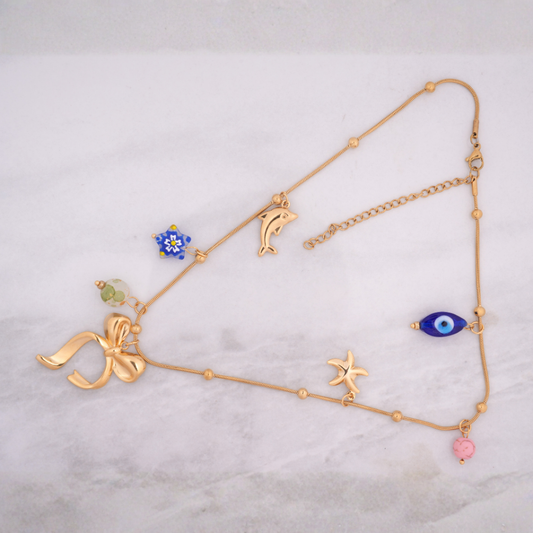 Gold-Tone Charm Necklace with Bow and Enamel Accents