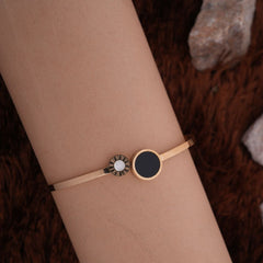 Elegant Golden Bracelet with Black & White Round Accents