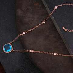 Rose Gold-Tone Blue Cushion-Cut Halo Pendant Necklace