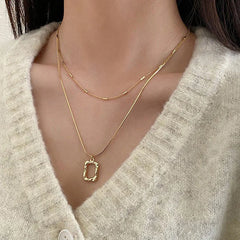 Layered Abstract Frame Pendant Necklace (Gold Tone)