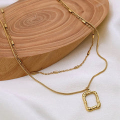Layered Abstract Frame Pendant Necklace (Gold Tone)